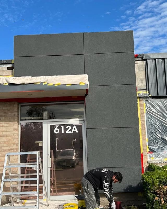 Clean acrylic stucco façade with crisp reveals installed by Ozwan Stucco